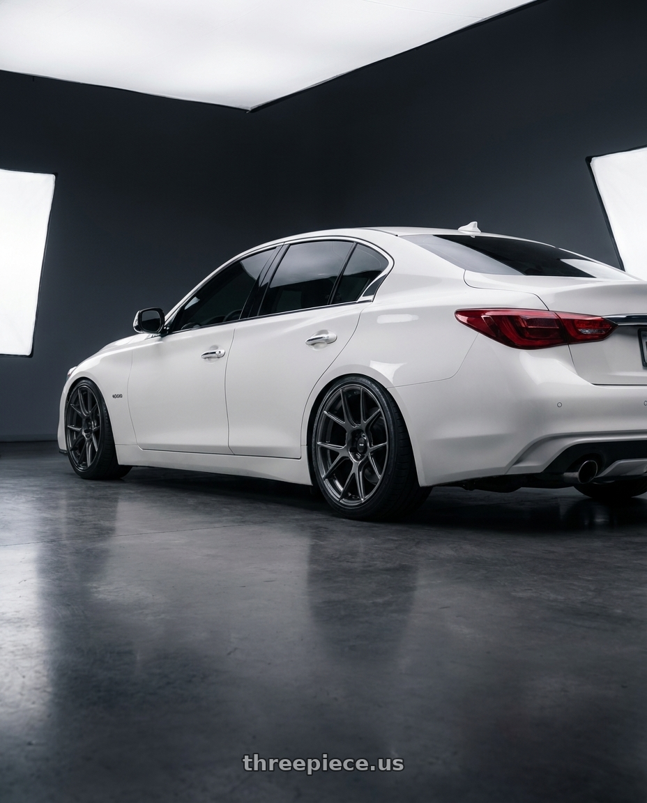 2020 Infiniti Q50 with Konig Ampliform 5x114.3 20x9.5+25 Dark Metallic Graphite wheels rear three quarter view slight stretch tires