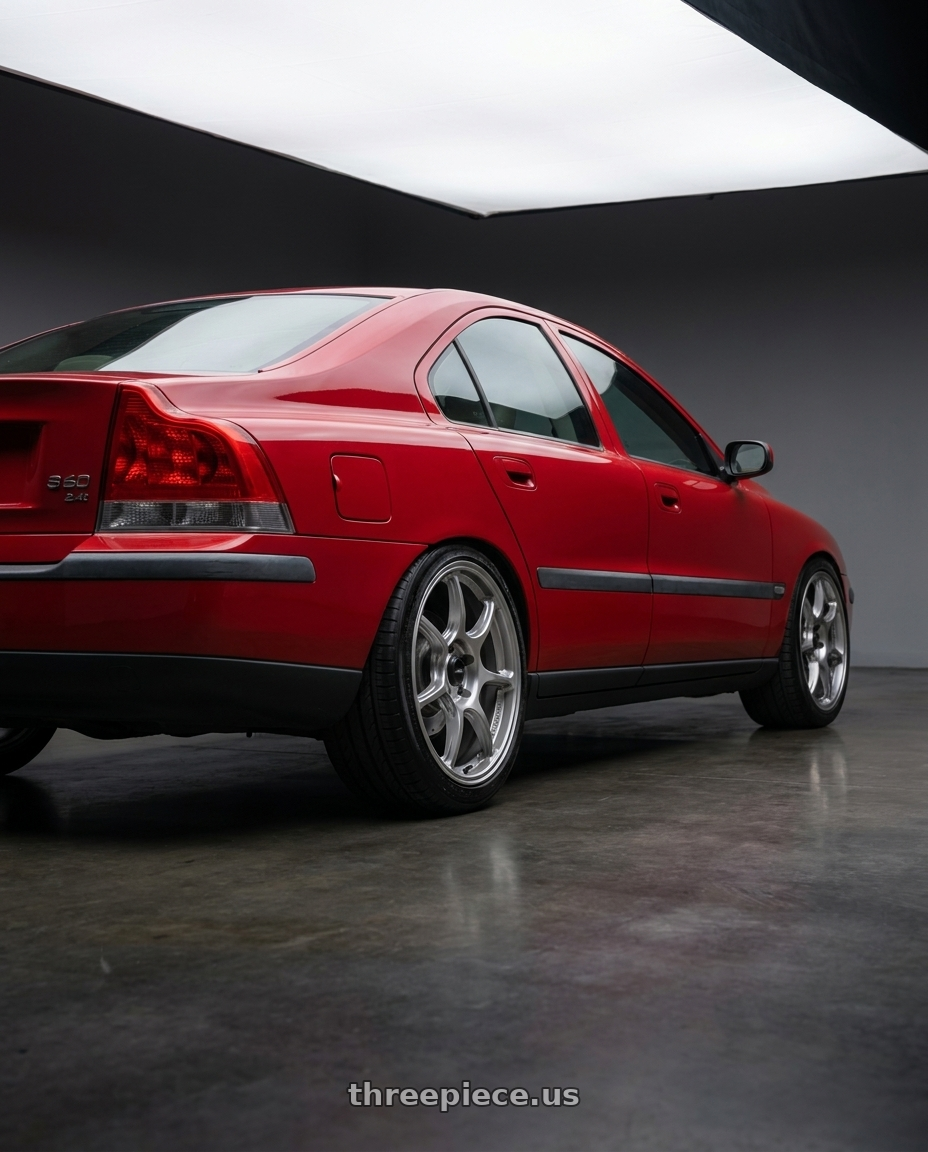 2002 Volvo s60 2.4t with Konig Ultragram 5x108 18x8.5+42 Titanium Metallic Knurled Bead wheels rear three quarter view slight stretch tires