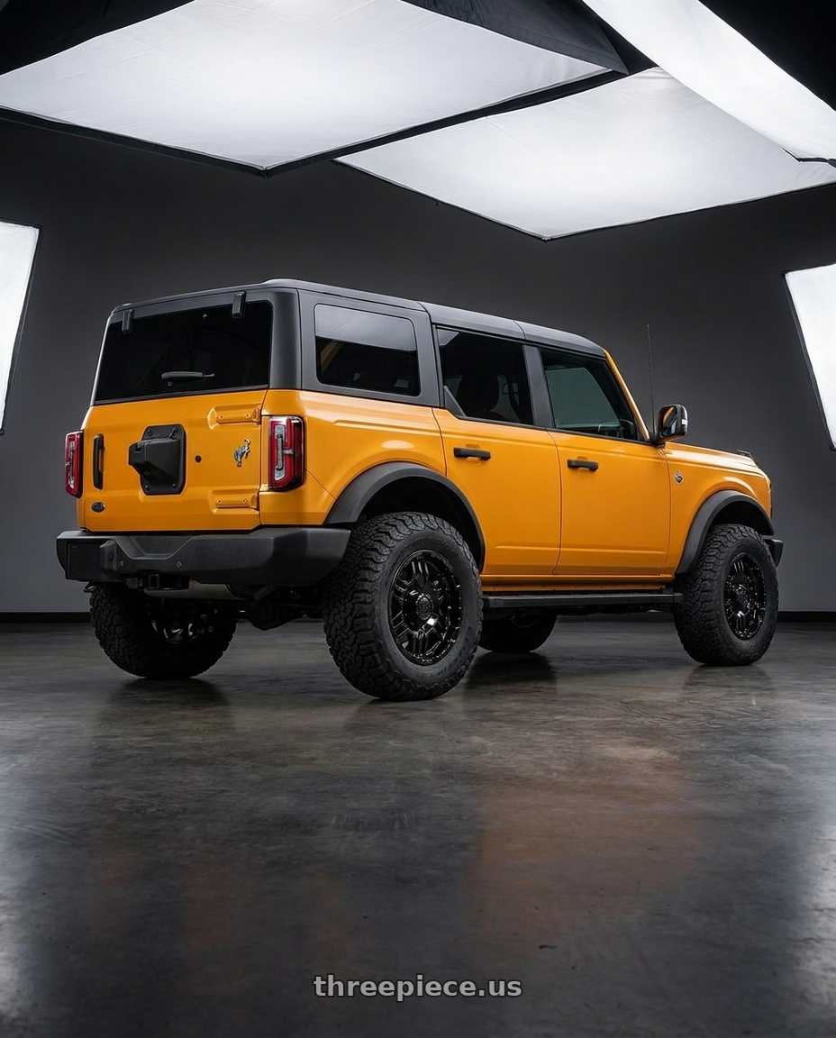 2024 Ford Bronco with Gear Off Road 713B 6x139.7 17x9 +10 Gloss Black wheels rear three quarter view meaty tires