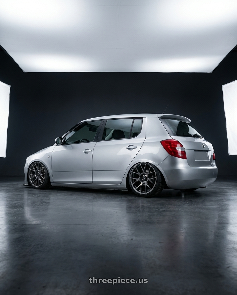 2012 Skoda fabia with Konig Ampliform 5x120 20x8.5+45 Dark Metallic Graphite wheels rear three quarter view slight stretch tires