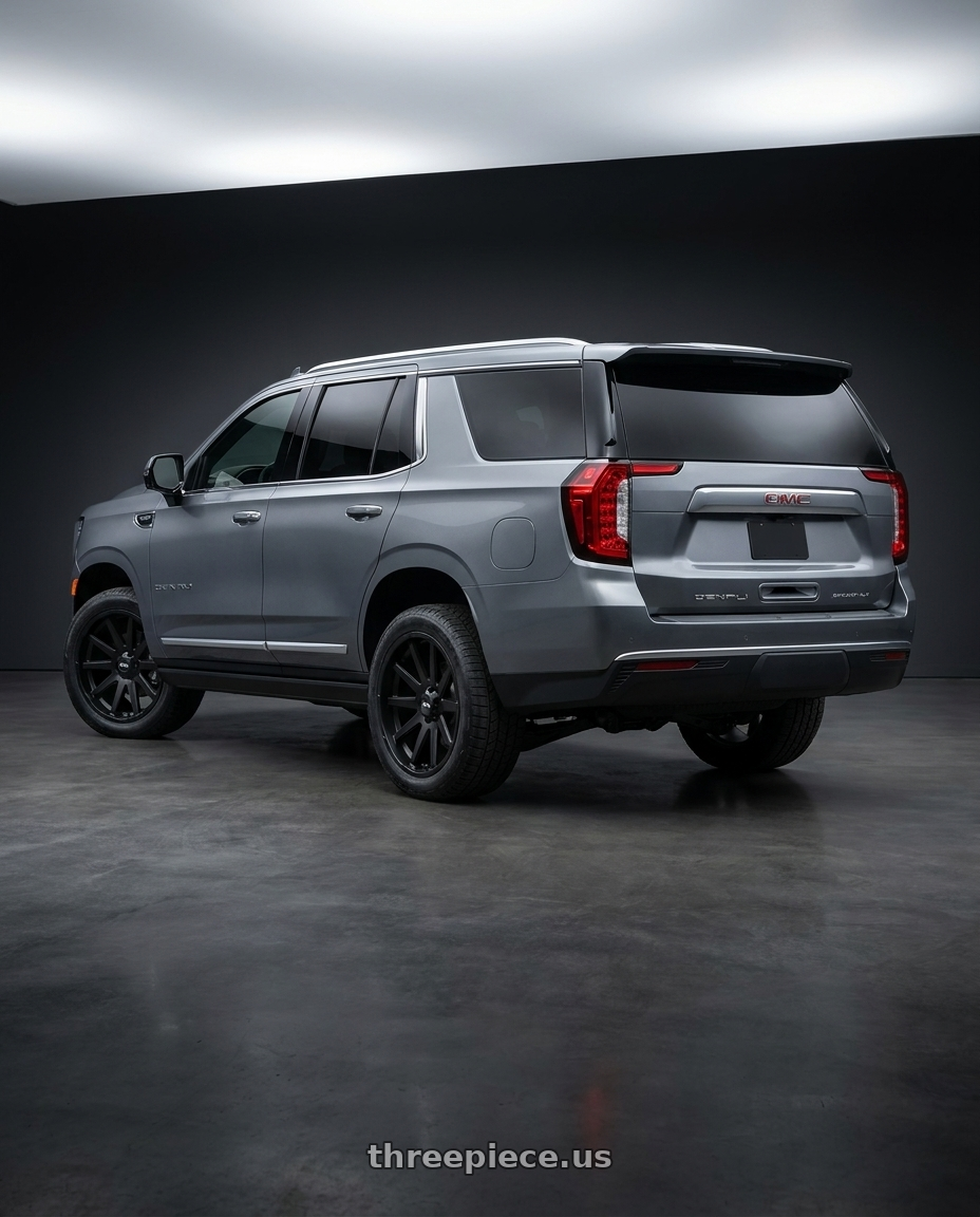2021 GMC Yukon Denali with Ion Type 143 6x139.7 20x9+18 Matte Black wheels rear three quarter view square tires