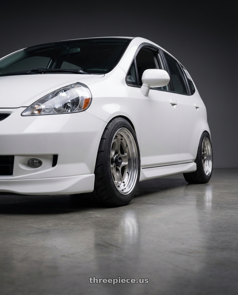 2007 Honda Fit  with Work Equip 40 4x100 15x6.5 +26 o disk Brut Silver wheels