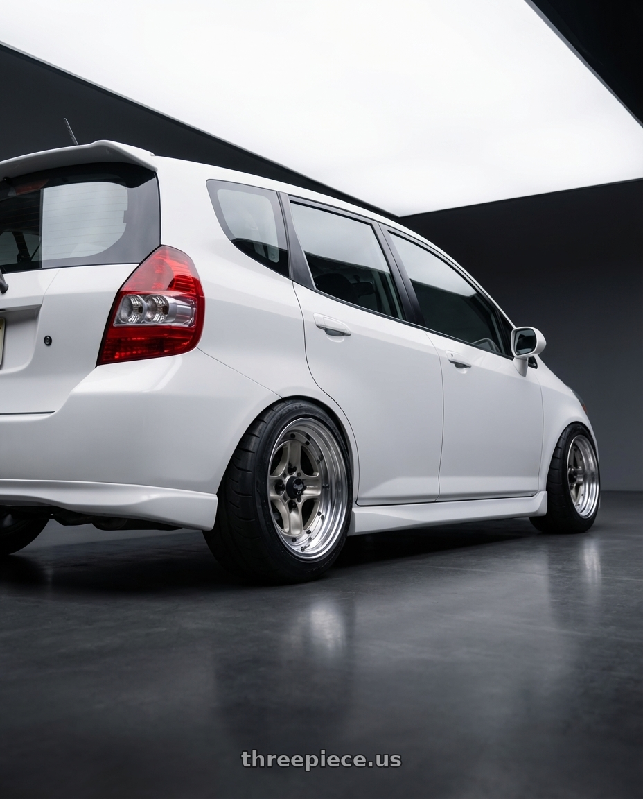 2007 Honda Fit  with Work Equip 40 4x100 15x6.5 +26 o disk Brut Silver wheels rear three quarter view meaty tires