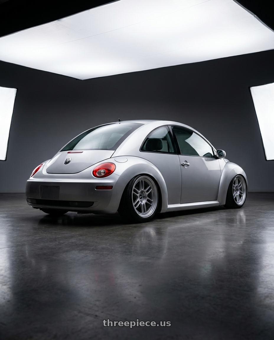 2006 Volkswagen new beetle with Enkei RPF1 5x100 18x8+35 Silver wheels rear three quarter view slight stretch tires