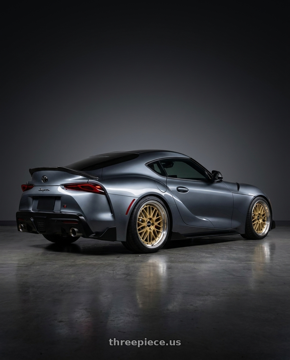 2019 TOYATA SUPRA with BBS LM 5x112 19x9.0+42 Gold wheels rear three quarter view square tires