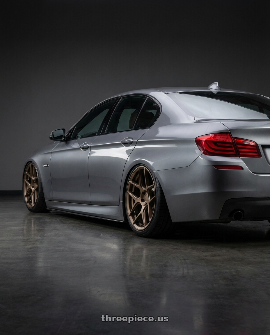 2016 BMW 5 Series F10 with Aodhan AFF2 5x120 20x9+30 Matte Bronze wheels rear three quarter view slight stretch tires