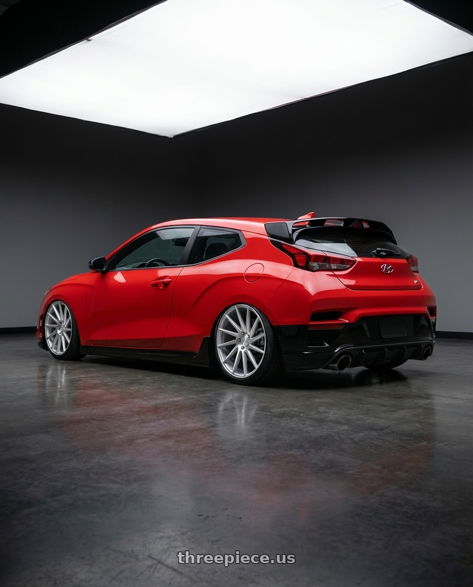 2022 Hyundai Veloster N with Niche 1PC M112 SURGE 5X114.3 19X8.5 +35 GLOSS SILVER MACHINED wheels rear three quarter view slight stretch tires