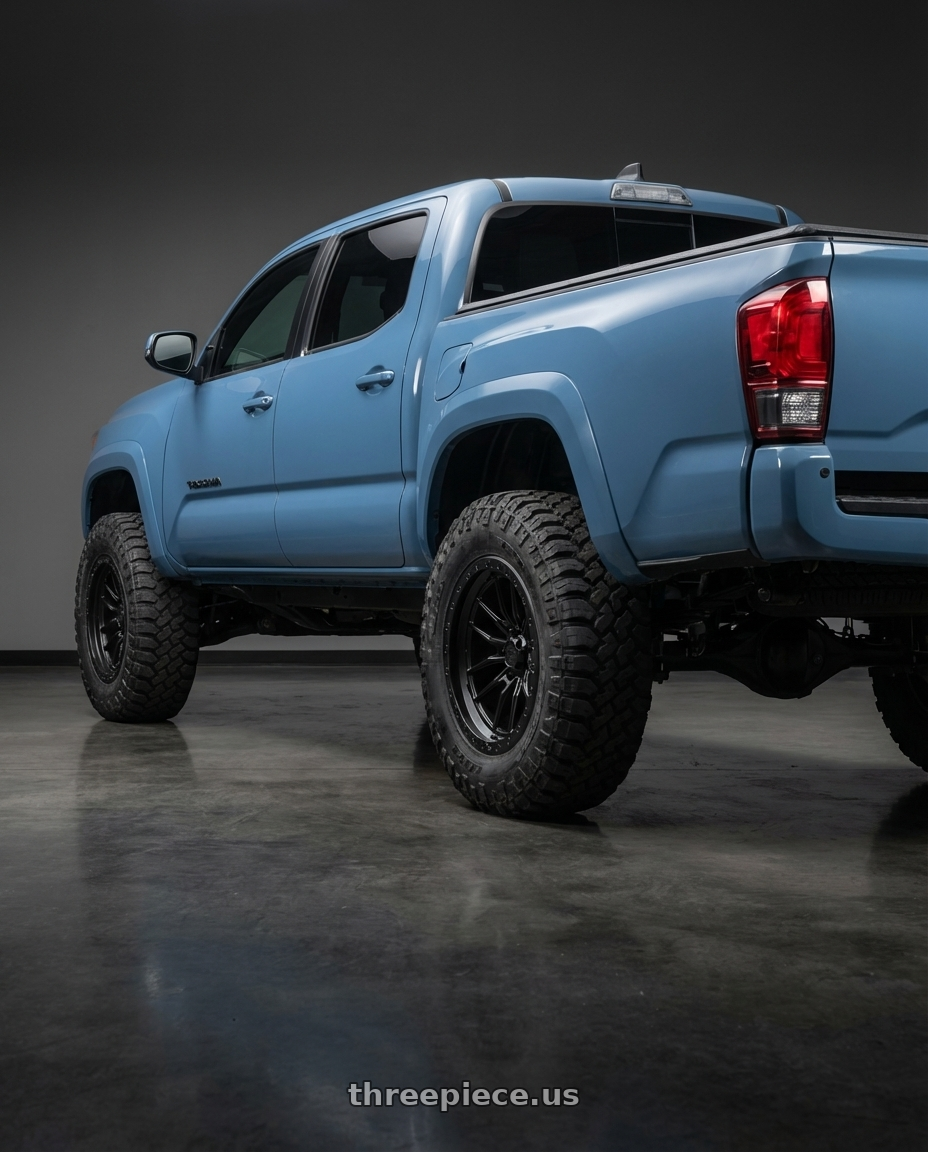 2019 Toyota Tacoma TRD Sport with LOCK OFFROAD KRAWLER 6x139.7 17x9 -12 Matte Black W Matte Black Ring wheels rear three quarter view meaty tires