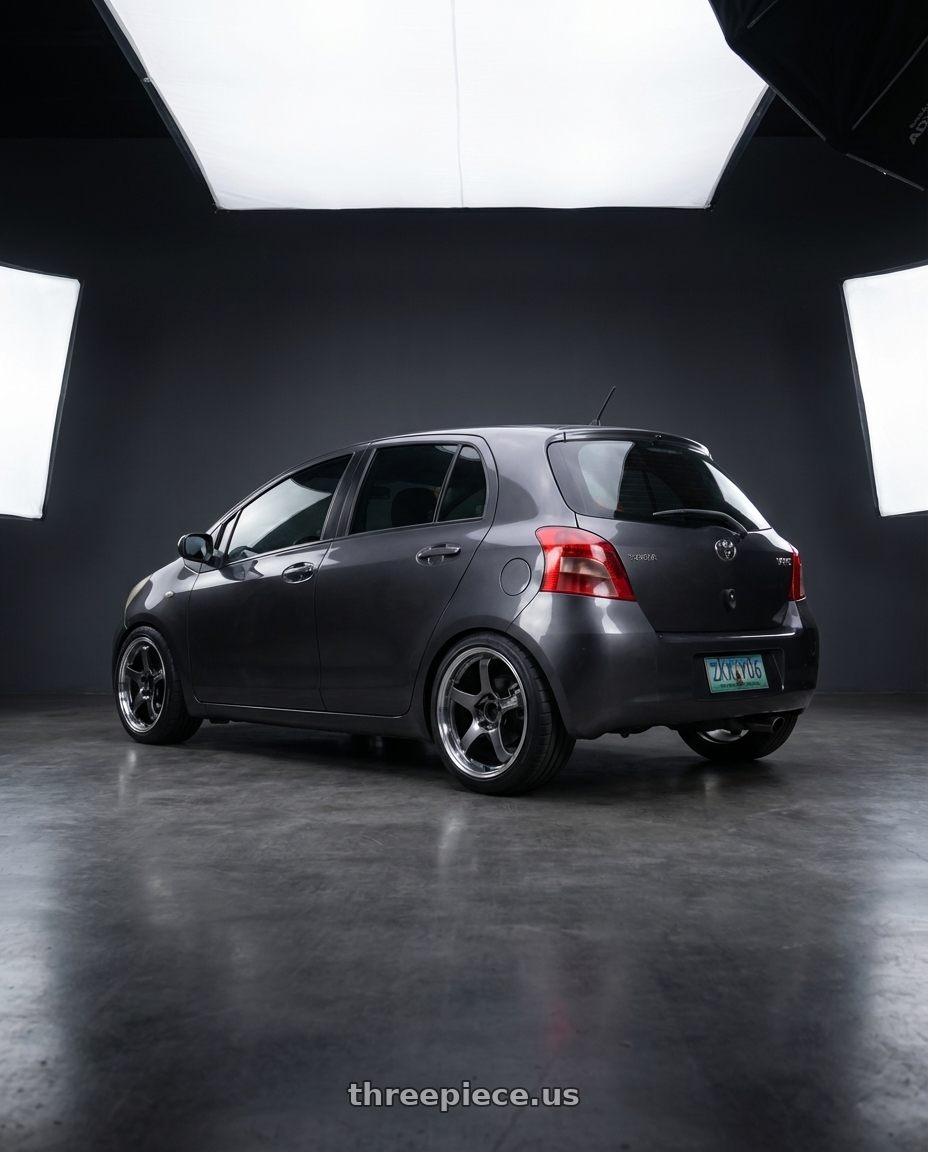 2007 Toyota Yaris with Advan Racing GT BEYOND 4x100 17x7.0 +45 MACHINING & HYPER PLATINUM BLACK wheels rear three quarter view square tires