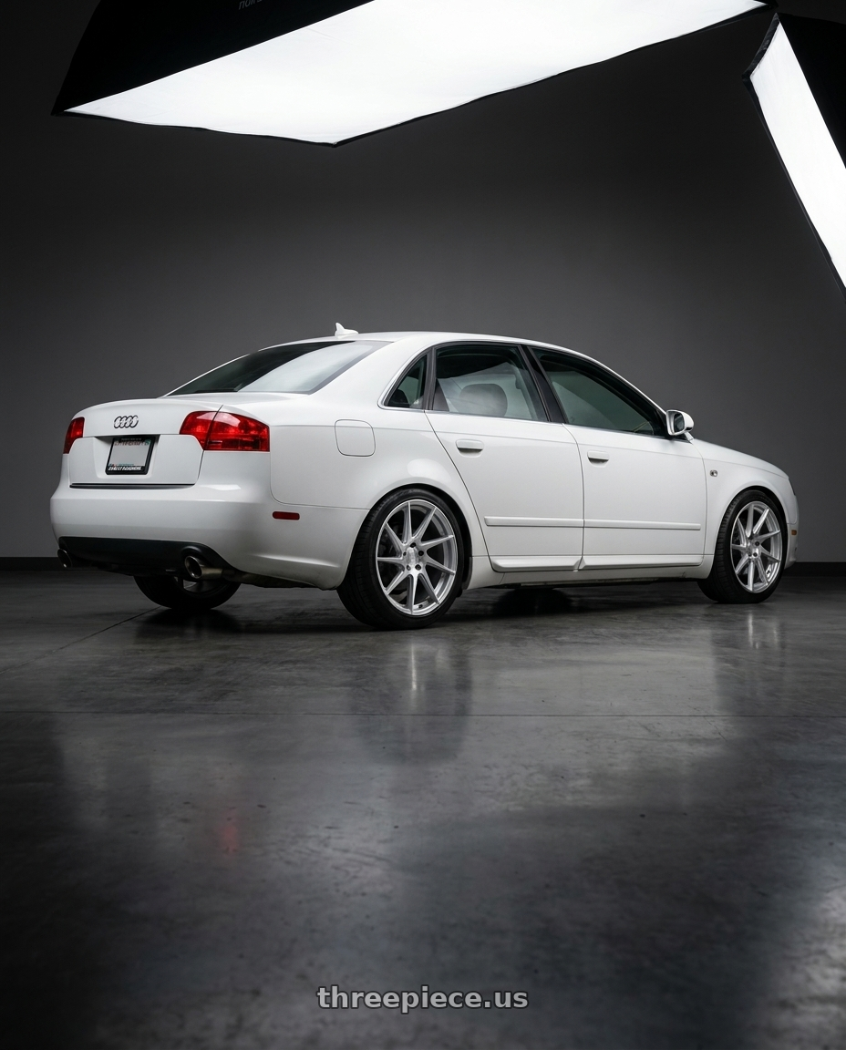 2010 Audi A4 B7 with Aodhan AH09 5x112 18x8.5 +35 Gloss Silver Machined Face wheels rear three quarter view square tires