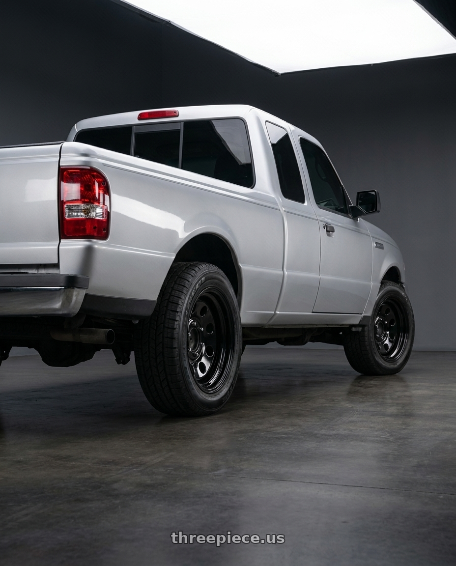 2011 Ford Ranger XLT with Vision HD 85H 5x114.3 15x8-29 Gloss Black wheels rear three quarter view square tires
