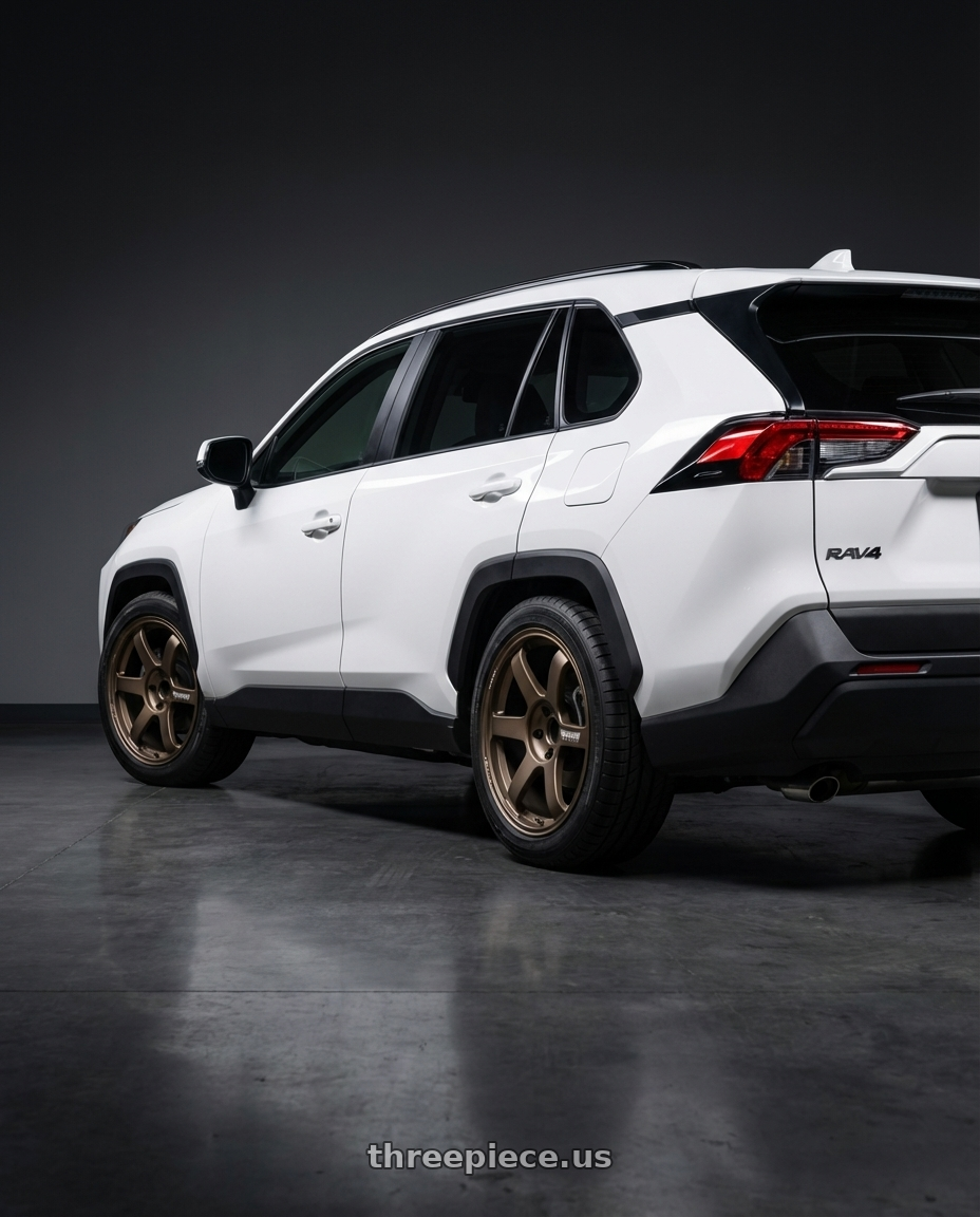 2023 Toyota rav4 xle white  with Volk Racing TE37 SAGA 5x110 17x8 +26 BRONZE wheels rear three quarter view square tires