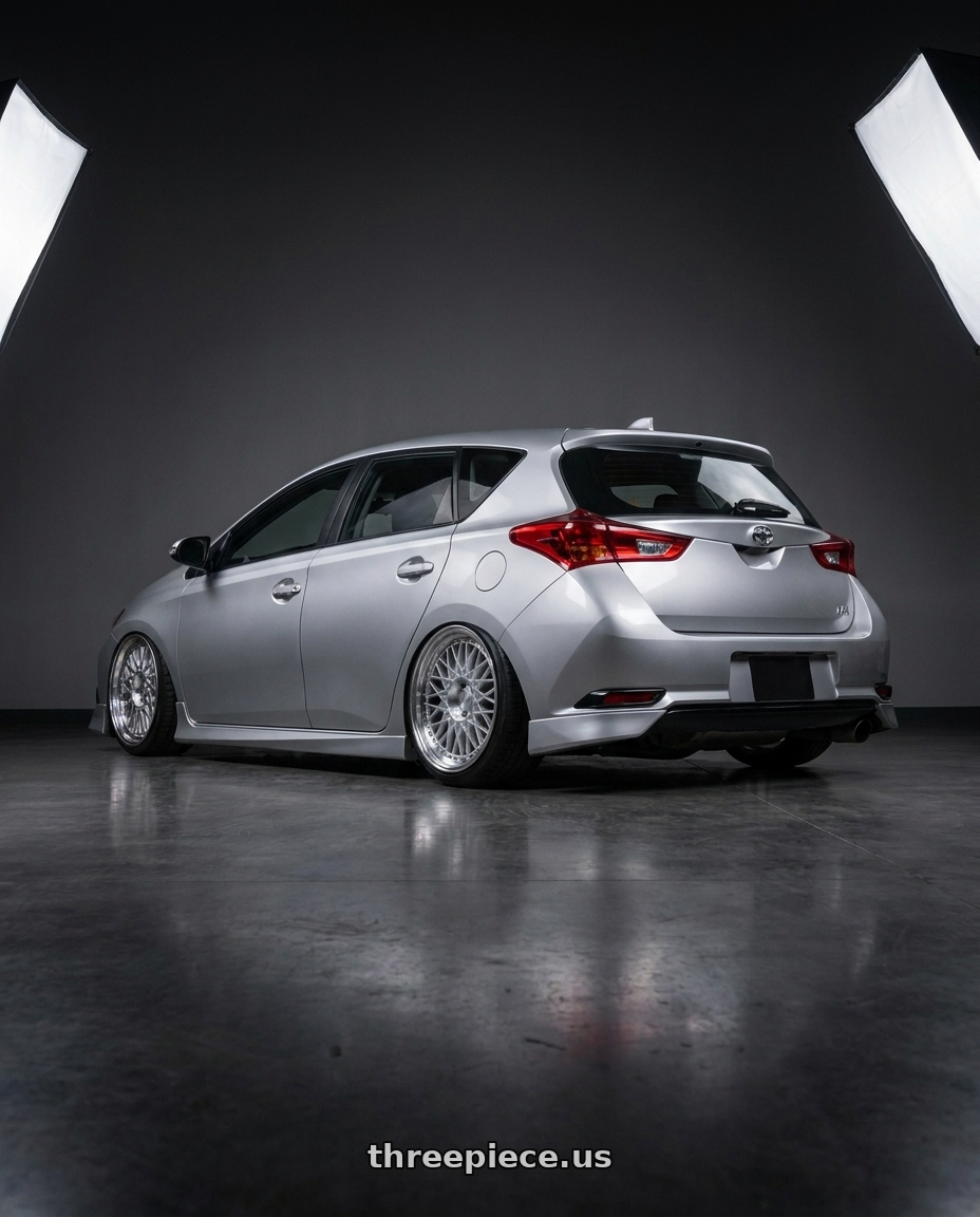 2016 Scion iM with Aodhan AH05 5x100 / 5x114.3 17x9+25 Silver w/Machined Face wheels rear three quarter view slight stretch tires