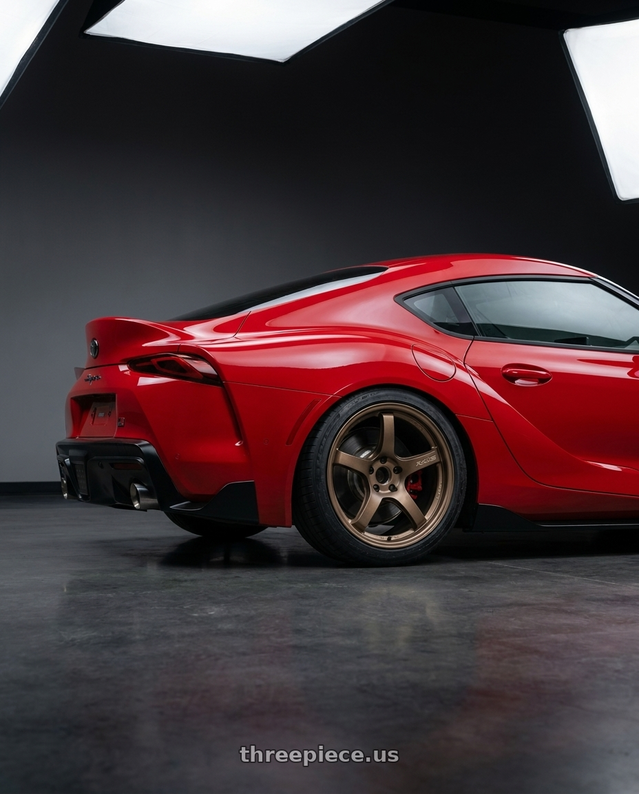2023 Toyota GR Supra with Gram Lights 57CR 5x112 19x10.5+35 Bronze II wheels rear three quarter view square tires