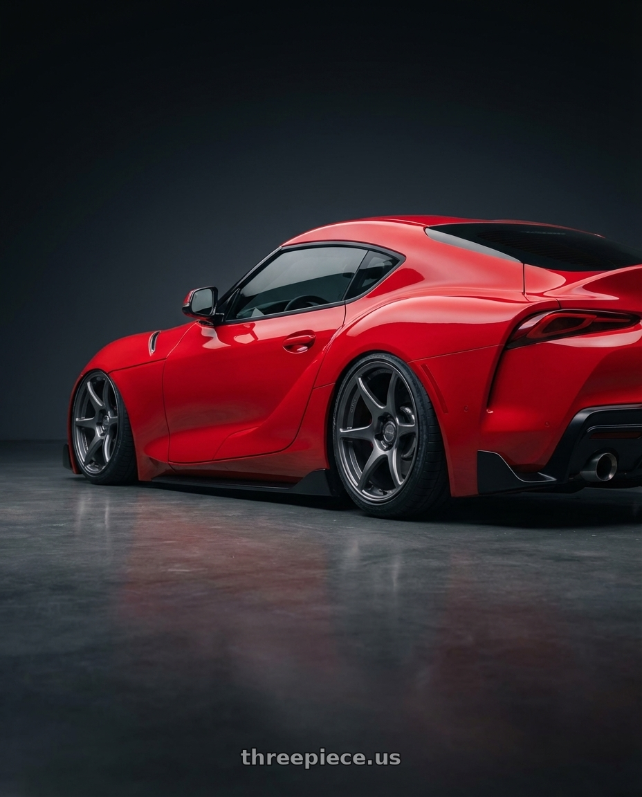 2023 Toyota GR Supra with Kansei K11G Tandem 5X112 19x9.5 22 Gunmetal wheels rear three quarter view slight stretch tires