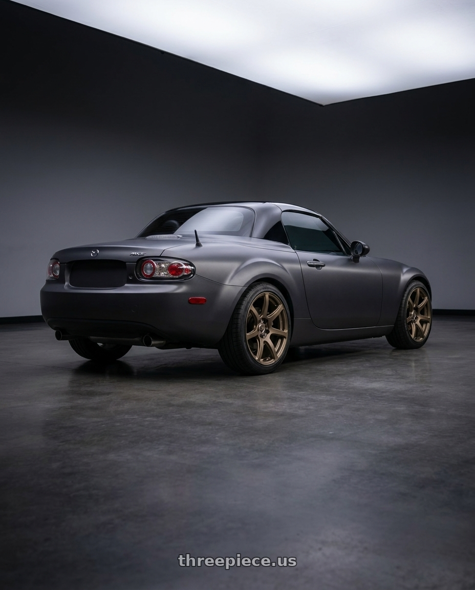 2007 Mazda Miata MX-5 with Work Emotion T7r 5x114.3 18x7.5 +47 Matte Bronze wheels rear three quarter view square tires