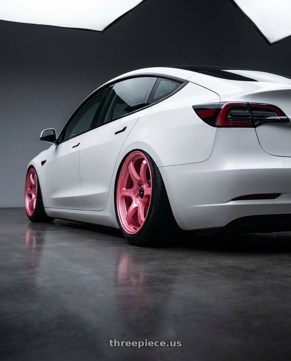 2021 tesla model 3 sr with Gram Lights 57DR LIMITED 5x114.3 18x8.5+37 Sakura Pink wheels rear three quarter view extreme stretch tires