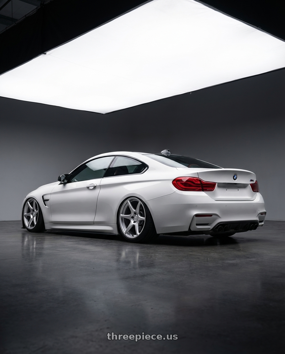 2018 BMW M4 F82 with Kansei K11S Tandem 5X120 19x9.5 22 Hyper Silver wheels rear three quarter view slight stretch tires