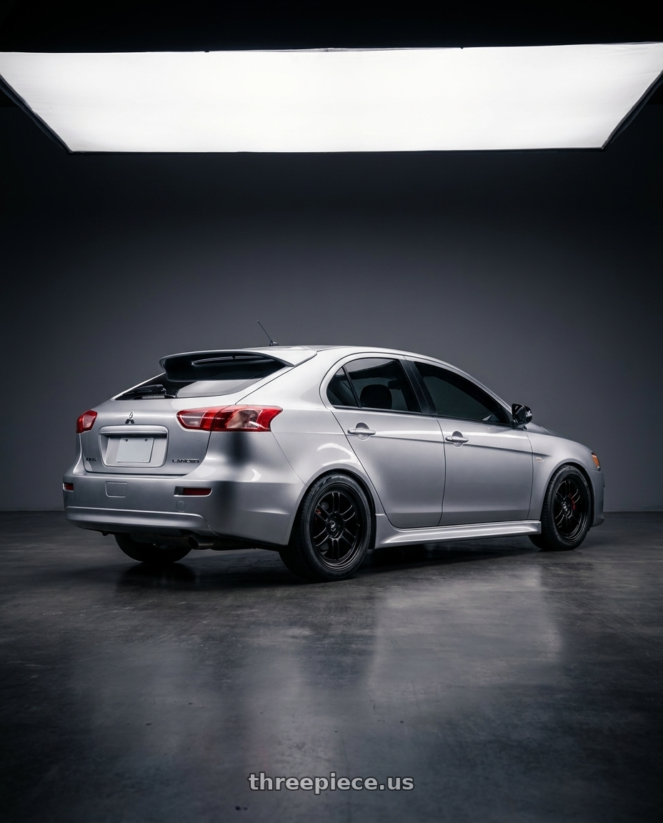 2016 Mitsubishi Lancer Sportback with Enkei RPF1 5x114.3 18x9.5+15 Gloss Black wheels rear three quarter view square tires
