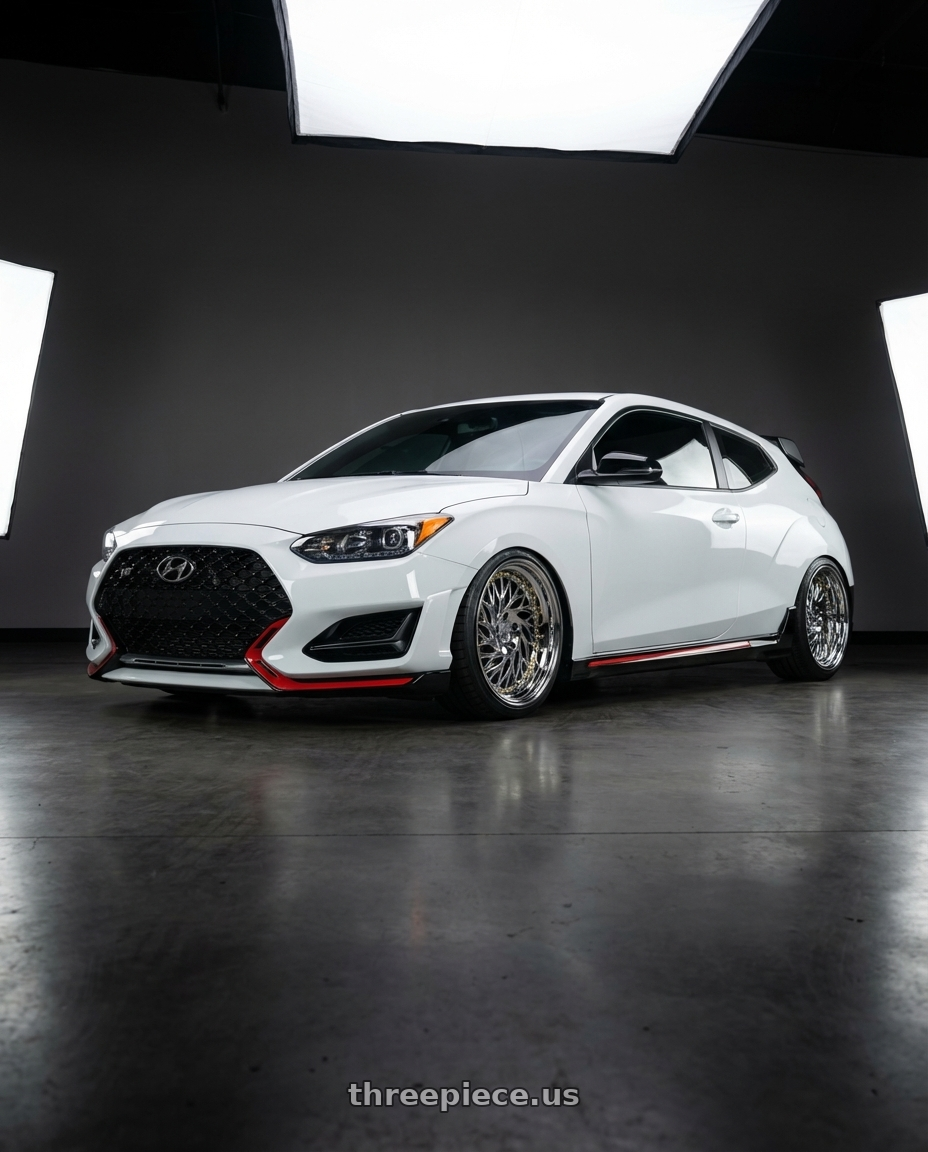 2022 Hyundai Veloster N, chalk white with Aodhan DS03 5x114.3 18x9.5 +30 Vacuum Chrome w/Gold Rivets wheels front three quarter view slammed stance