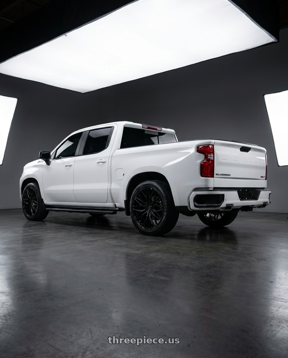 2024 Chevy Silverado Rst with Brada FR86 6x139.7 22x10 -18 Gloss Black wheels rear three quarter view square tires