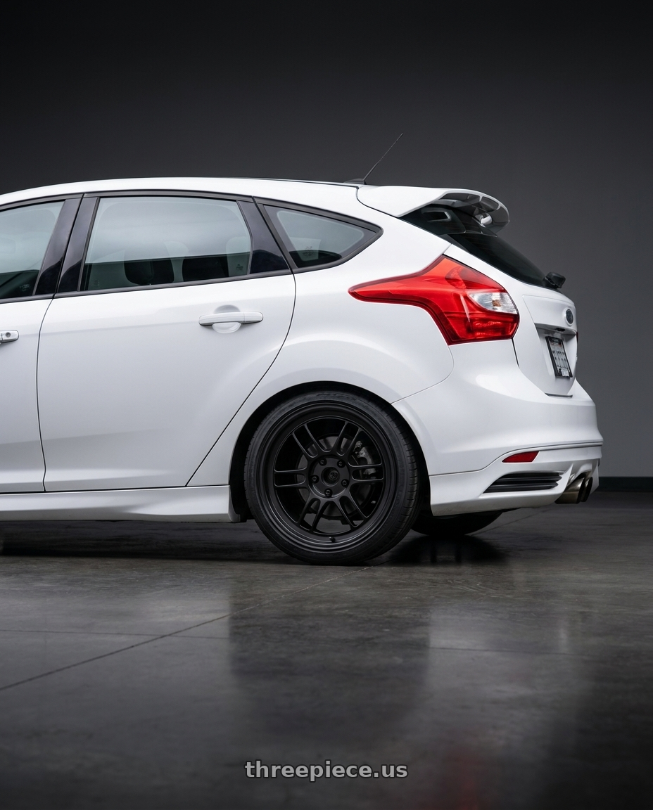 2014 Ford Focus ST with Enkei RPF1 5x100 17x8+35 Black wheels rear three quarter view square tires