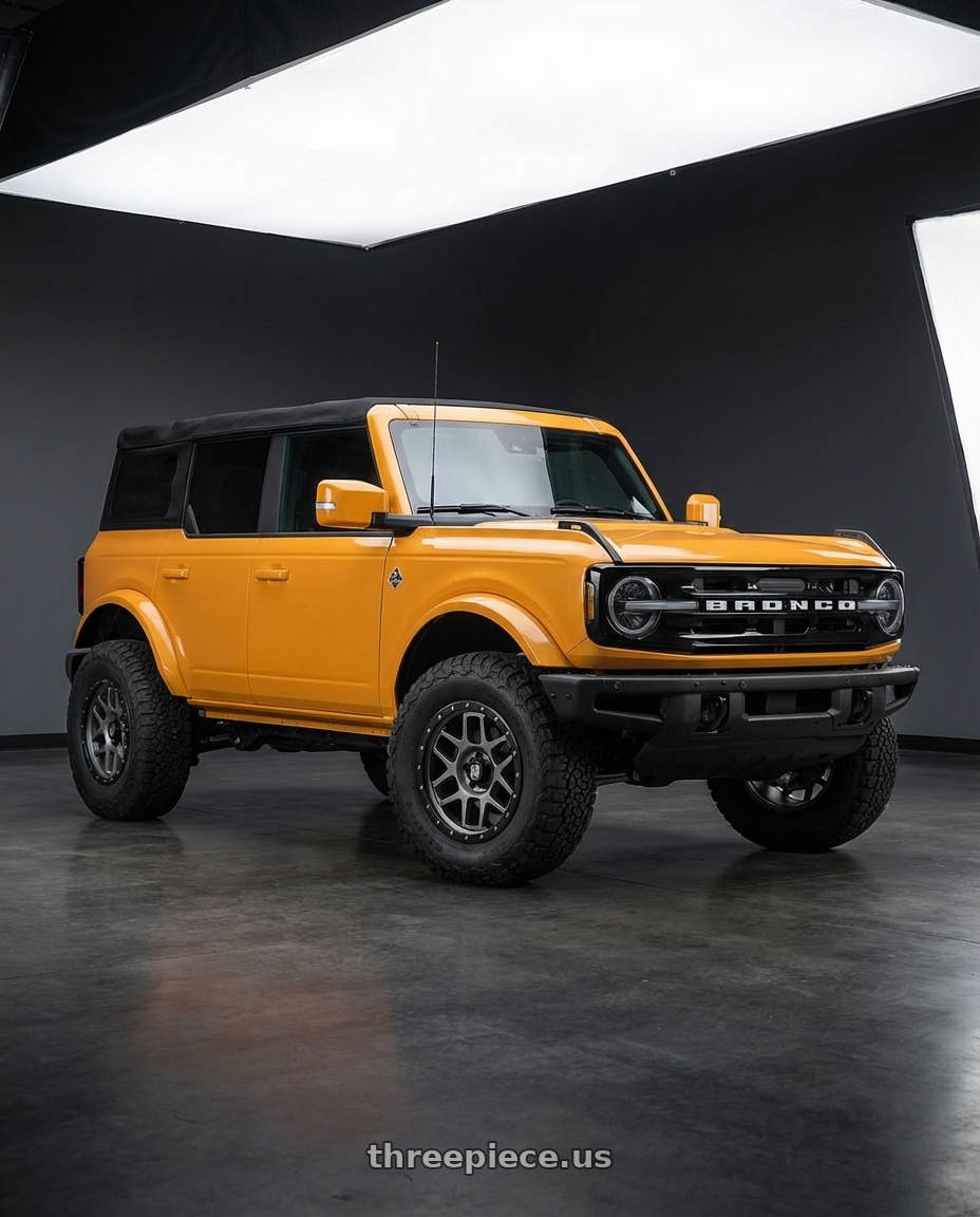 2024 Ford Bronco with XD XD127 BULLY 6X139.7 20X9 +18 MATTE GRAY BLACK RING wheels front three quarter view lifted stance