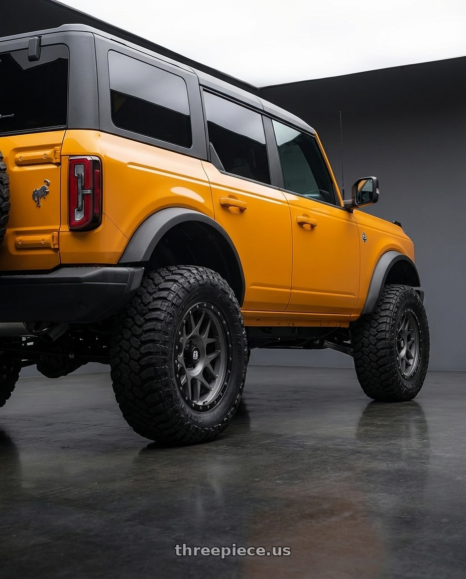 2024 Ford Bronco with XD XD127 BULLY 6X139.7 20X9 +18 MATTE GRAY BLACK RING wheels rear three quarter view meaty tires