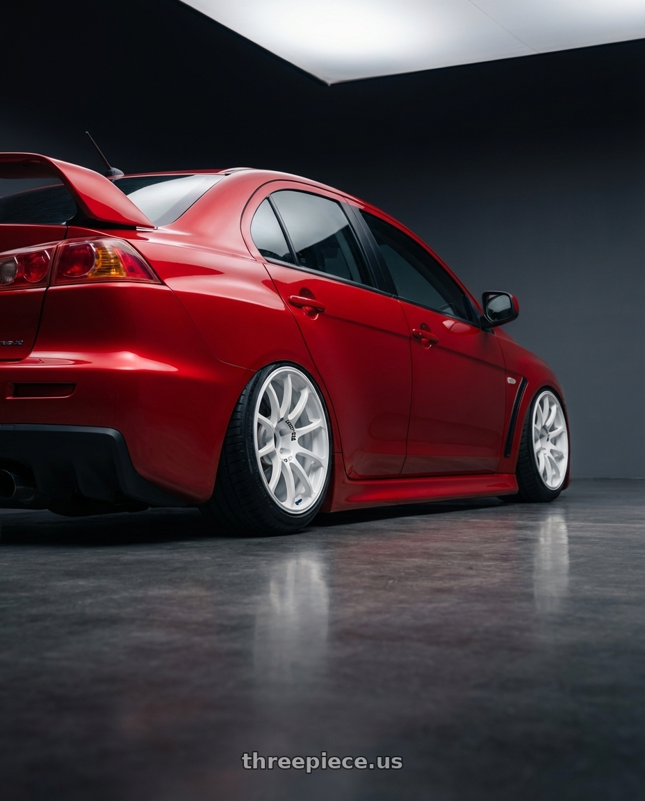 2012 Mitsubishi Lancer Evo X with Advan RCIII 5x114.3 18x8.5+38 White wheels rear three quarter view slight stretch tires