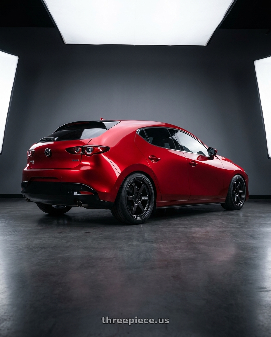 2024 Mazda 3 with Volk Racing G16 M-SPEC 5x112 19x8.5 +38 PRESSED BLACK CLEAR wheels rear three quarter view slight stretch tires