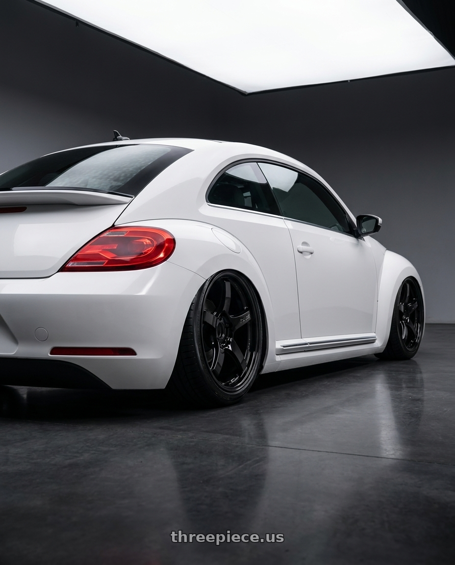 2016 Volkswagen Beetle Turbo with Gram Lights 57CR 5x112 19x8.5+45 Glossy Black wheels rear three quarter view slight stretch tires