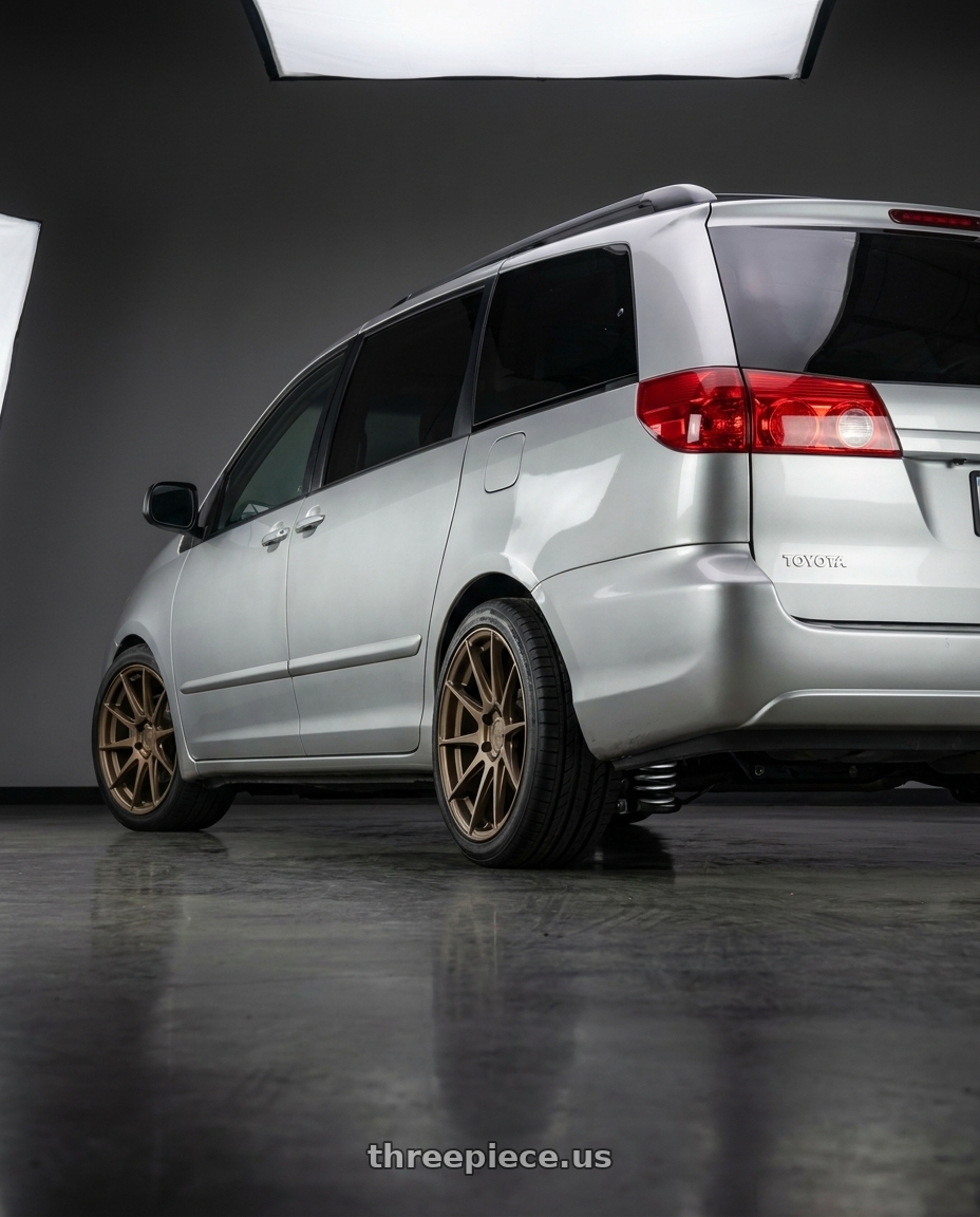 2007 toyota sienna with Aodhan AH09 5x114.3 18x8.5 +35 Matte Bronze wheels rear three quarter view square tires
