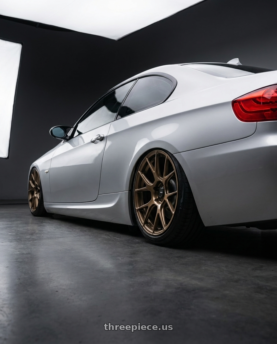 2012 BMW 3 Series E92 with Konig Ampliform 5x120 19x10+28 Gloss Bronze wheels rear three quarter view slight stretch tires