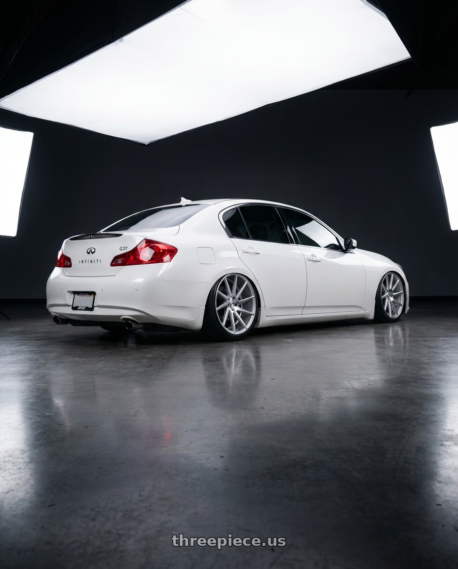 2012 Infiniti G37 with Niche 1PC M112 SURGE 5X114.3 19X8.5 +35 GLOSS SILVER MACHINED wheels rear three quarter view slight stretch tires