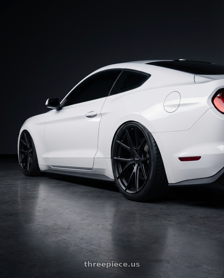 2018 Ford Mustang with Bravado 08B Tribute 5X115 20x9.5 +18 Matte Black wheels rear three quarter view square tires