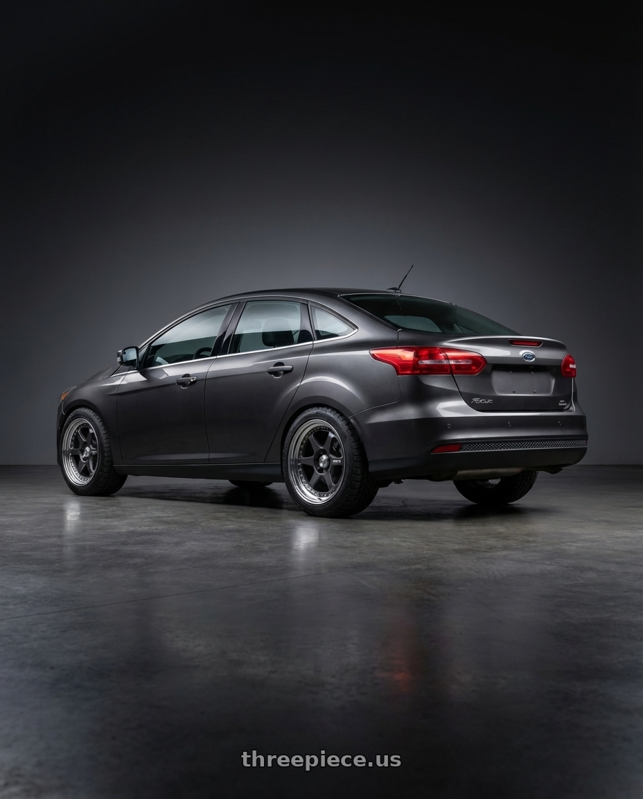 2018 Ford Focus with Work Meister L1 3P 5x100 18x7+19 A Disk Matte Gunmetal wheels rear three quarter view meaty tires