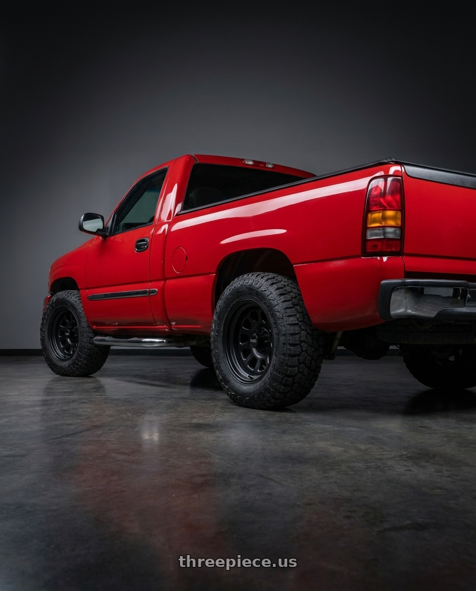 2004 gmc sierra 1500 fire with Black Rock 942B Black D-Window 6x139.7 16x8 13 Matte Black wheels rear three quarter view meaty tires