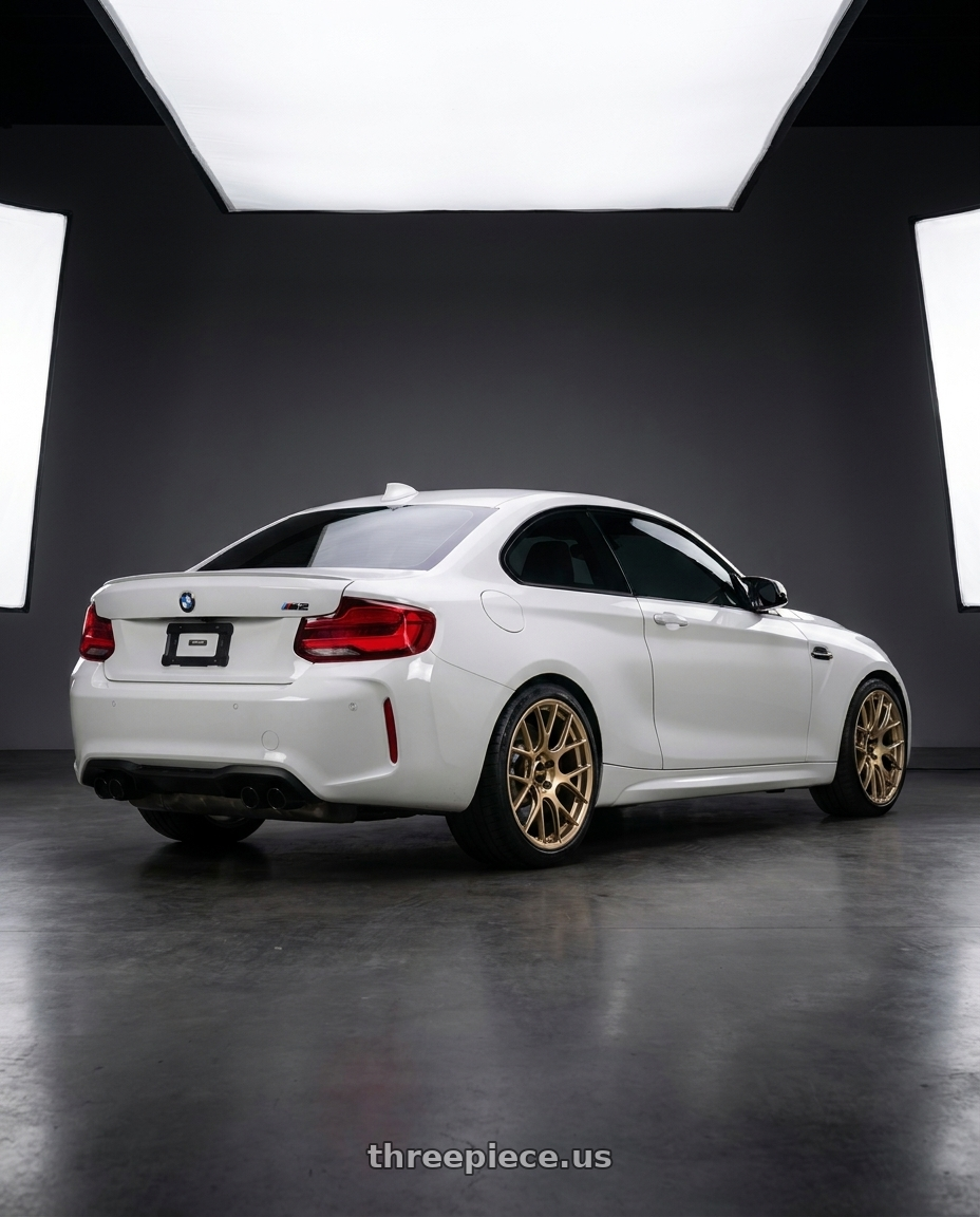 2019 BMW M2 Competition with BBS RE-V7 5x120 19x9.5 +25 Gold wheels rear three quarter view square tires
