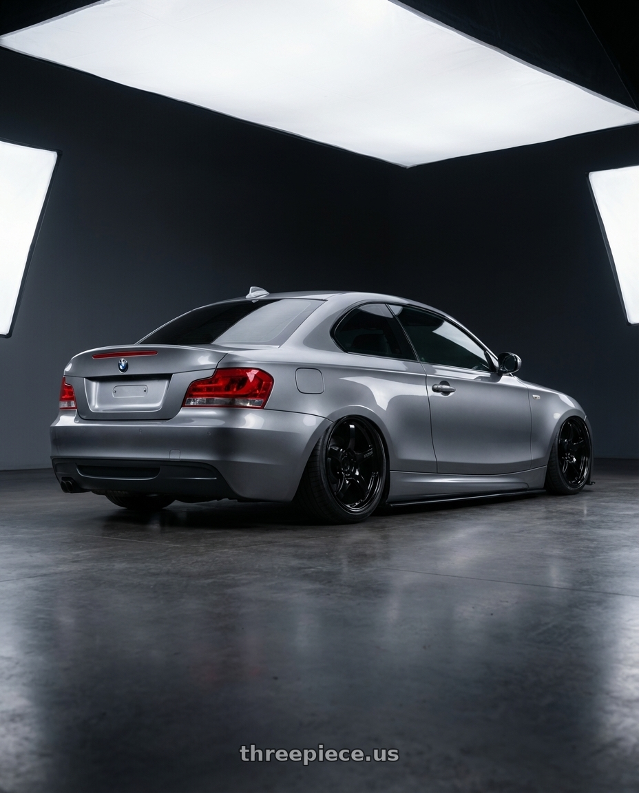 2012 BMW 1 Series E82 with Gram Lights 57CR 5x120 19x10.5+22 Glossy Black wheels rear three quarter view slight stretch tires