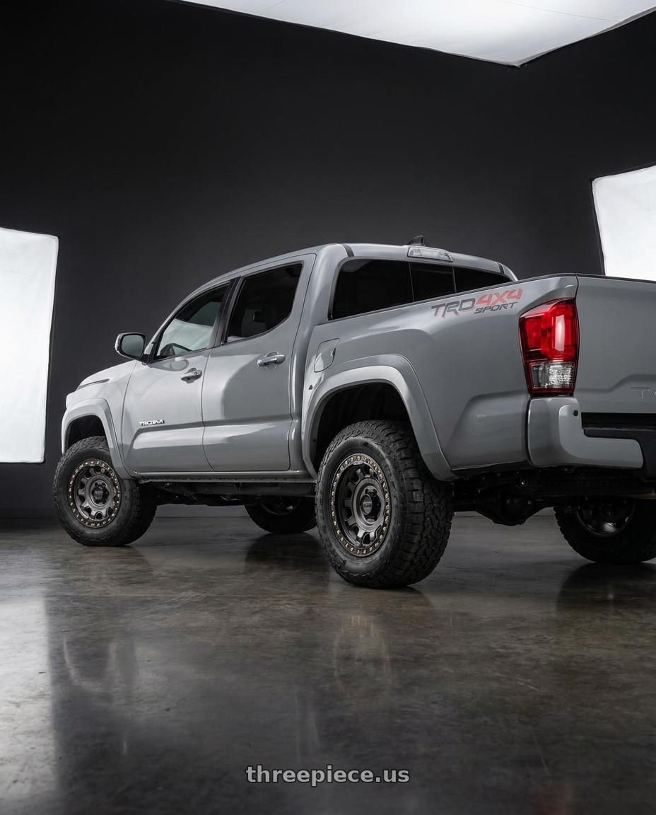 2021 Toyota Tacoma TRD Sport with KMC KM236 TANK BEADLOCK 6X139.7 17X9 -15 ANTHRACITE wheels rear three quarter view square tires