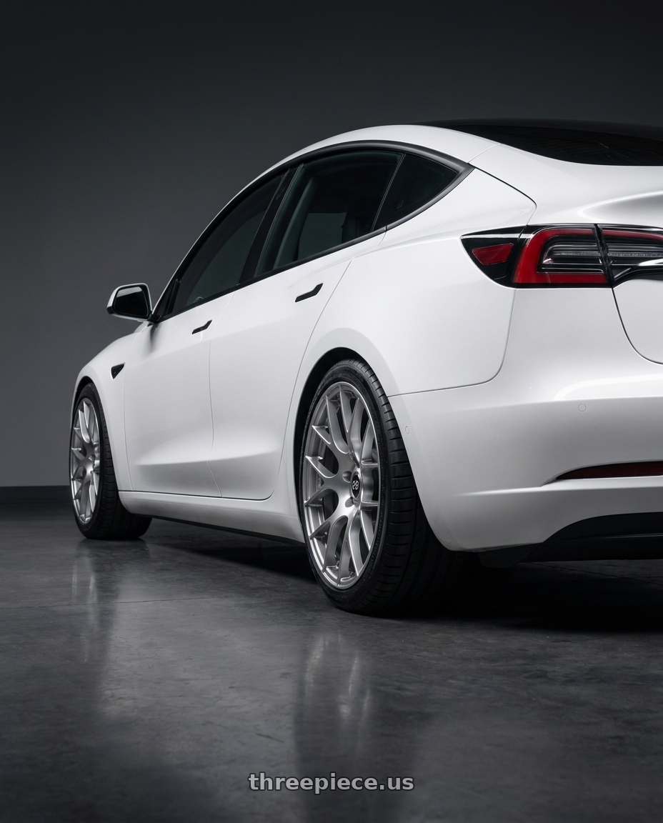 2022 Tesla Model 3 with Enkei Raijin 5x114.3 19x8.5+35 Hyper Silver wheels rear three quarter view square tires