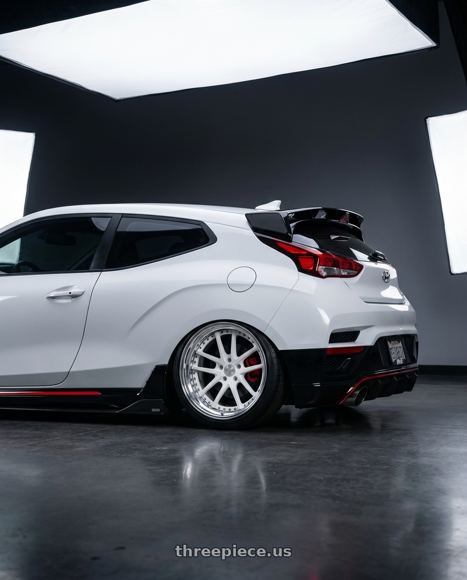 2022 Veloster N, lunar white with Heritage Wheel ASAN wheels rear three quarter view slight stretch tires