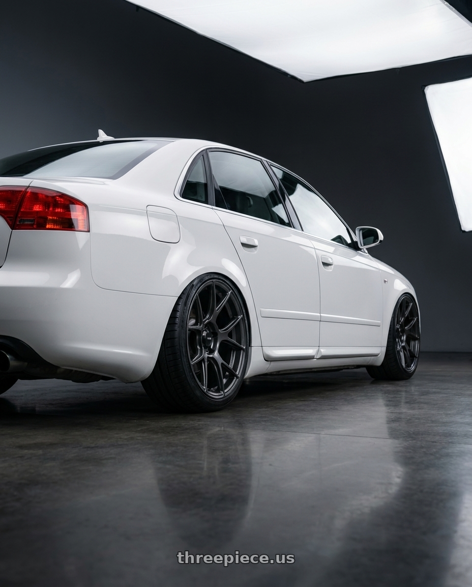 2010 Audi A4 B7 with Konig Ampliform 5x112 19x8.5+32 Dark Metallic Graphite wheels rear three quarter view slight stretch tires