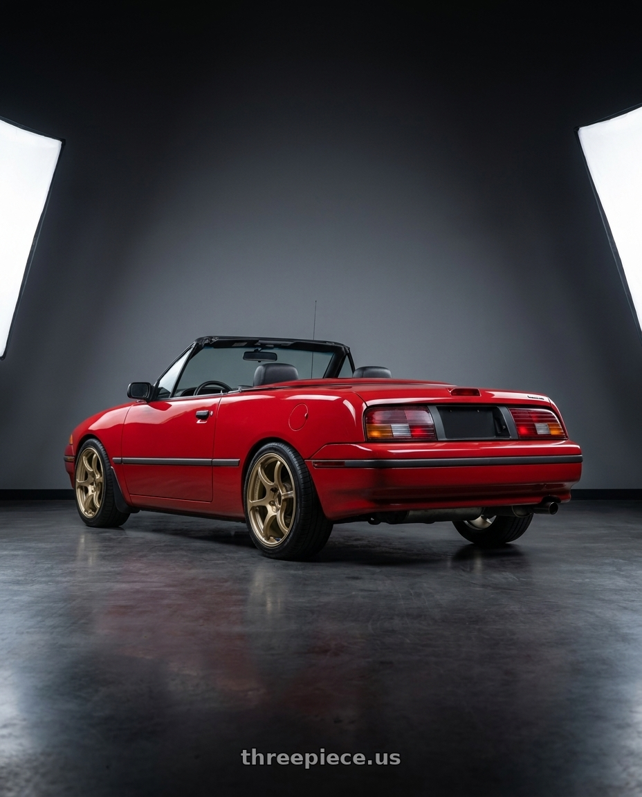 1991 Mercury Capri with Advan RGIII 4x100 18x7.0+42 Gold wheels rear three quarter view square tires