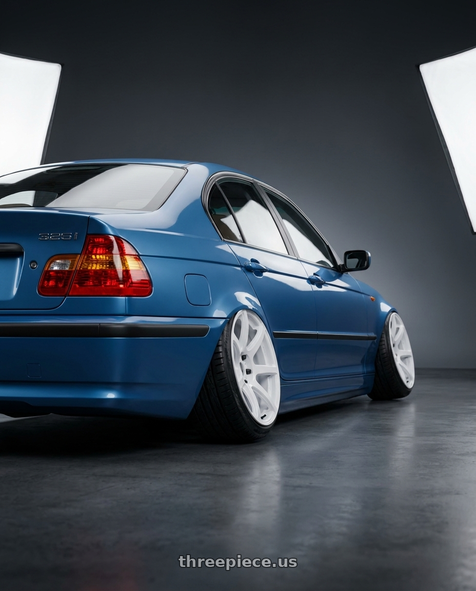 2003 bmw 325i with Work Emotion T7R wheels rear three quarter view slight stretch tires