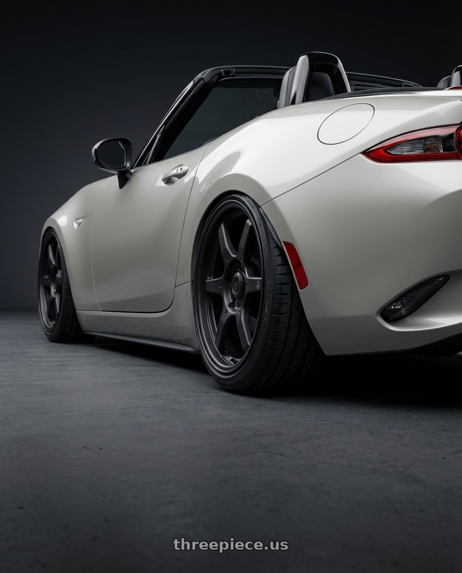 2021 Mazda MX-5 Miata ND with Konig Backbone 5x114.3 17x7.5+45 Matte Black Milling Logo on Spoke wheels rear three quarter view slight stretch tires