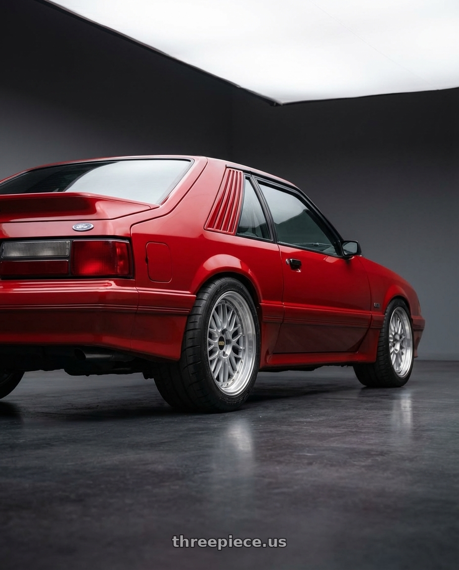 1986 Ford Mustang GT Rapid Red with BBS LM 5x114.3 18x10.0+25 Diamond Silver wheels rear three quarter view meaty tires