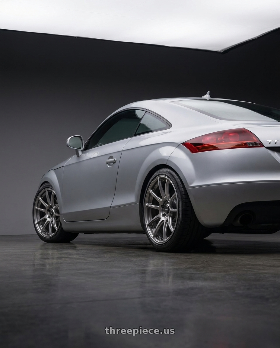 2008 Audi TT with Konig Heliogram 5X112 18x9.5+35 Titanium Metallic Knurled Bead Flow Formed wheels rear three quarter view square tires