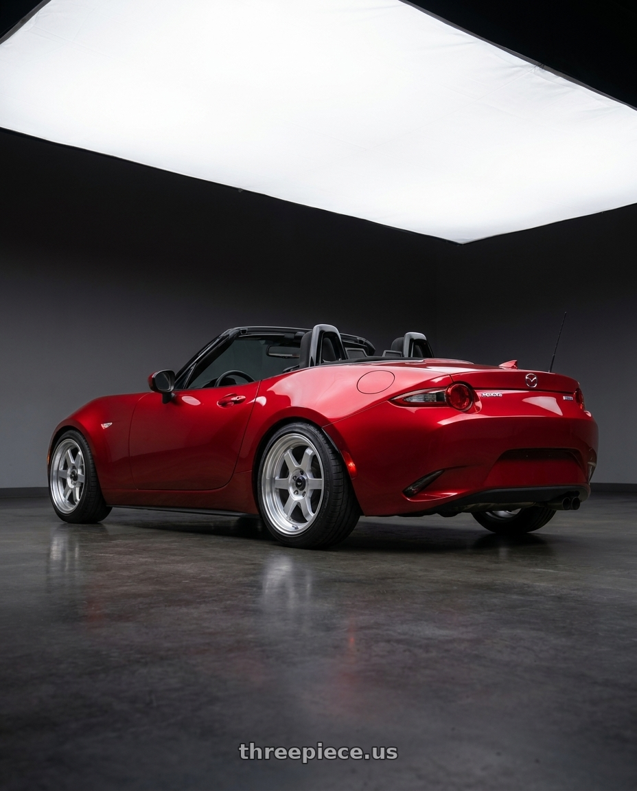 2016 Mazda Miata with Vors TR7 4x100/4x114.3 16x7  +35 Silver Machine Face Lip wheels rear three quarter view square tires