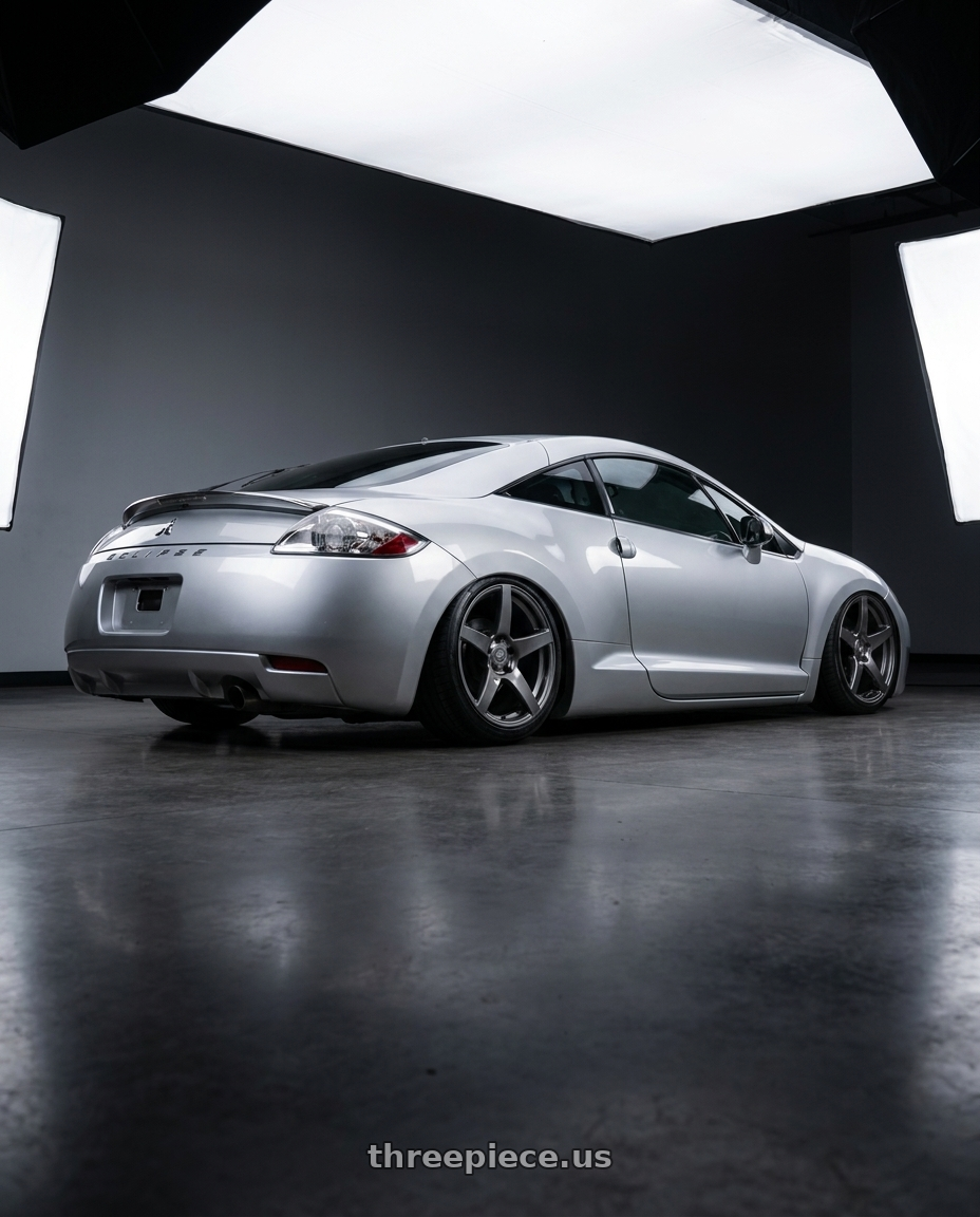 2010 Mitsubishi Eclipse with Forgestar CF5 5x114.3 18x10 +42 Gloss Anthracite wheels rear three quarter view slight stretch tires